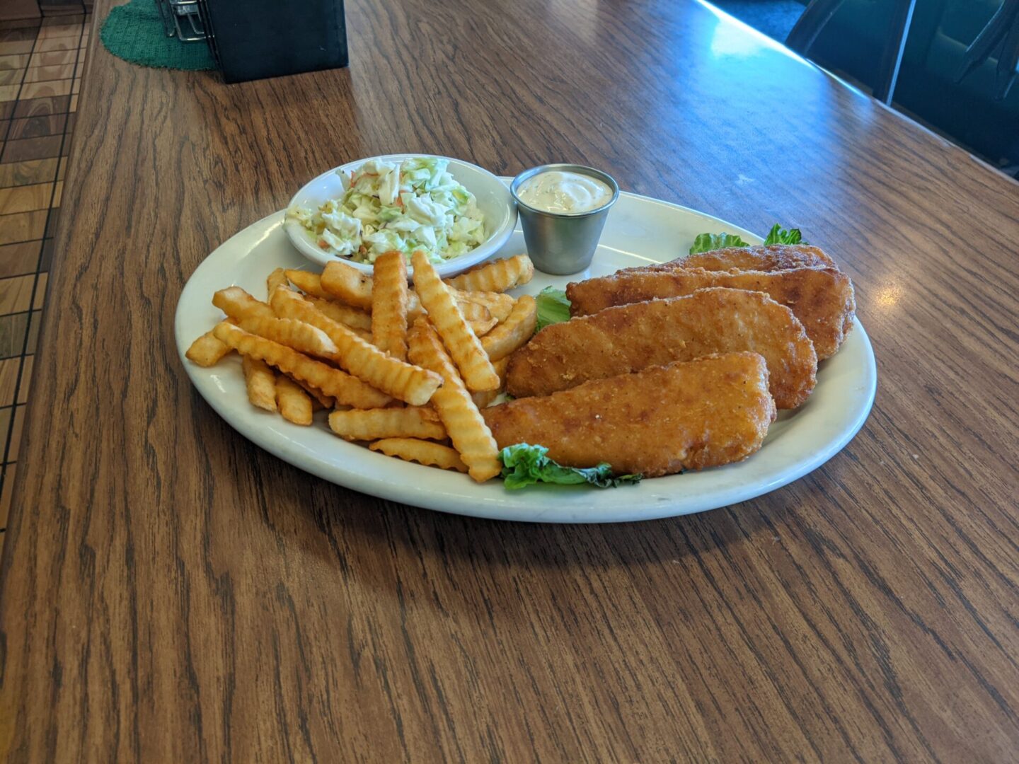 A plate of food on the table at a restaurant.